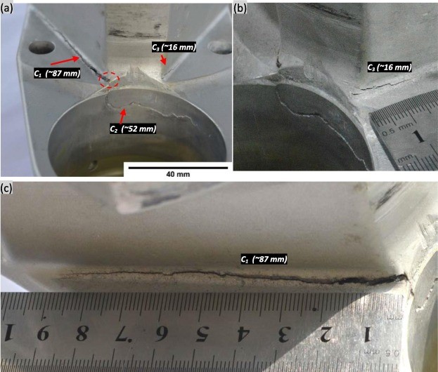 Fig. 4. Cracks on cylinder block assembly (a) C1, C2 and C3 cracks are indicated (b) Short length crack C3 (c) a closer view of long crack C1