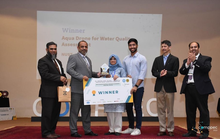 Figure 7: Aqua Drone team receiving winning prize at 20th edition of COMPEC 2023